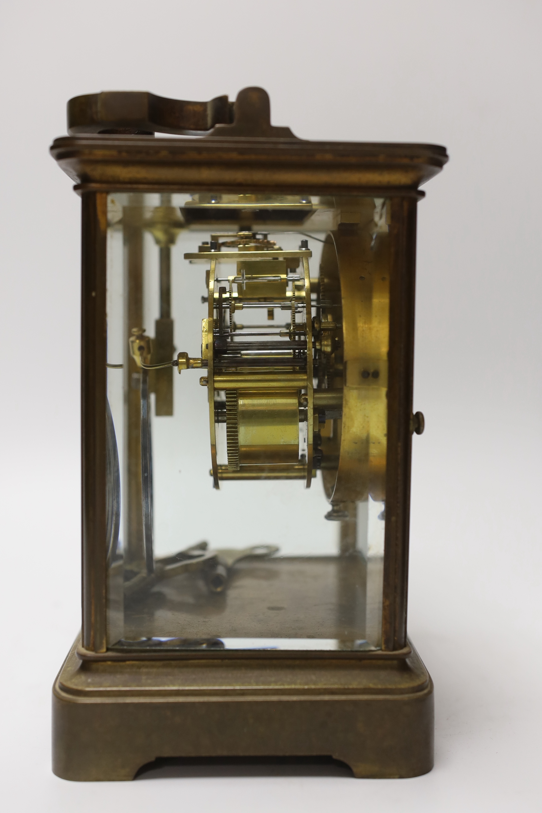 A large 19th century carriage clock with enamel dial and velvet lined leather case, the clock 19cm high